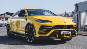 A yellow Lamborghini Urus SUV