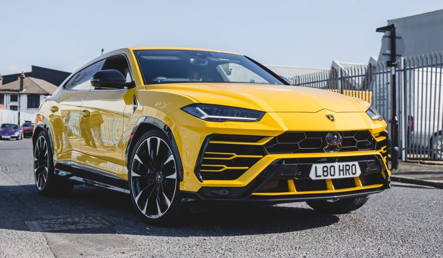 A yellow Lamborghini Urus SUV