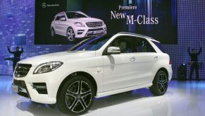 A white Mercedes M-Class SUV on display