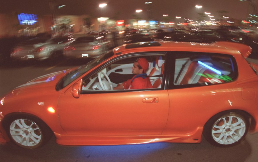 18-year-old Faraz Matin drives his modified 1993 Honda Civic through a parking lot near Collossus an