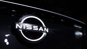 A backlit NIssan logo on a black grille