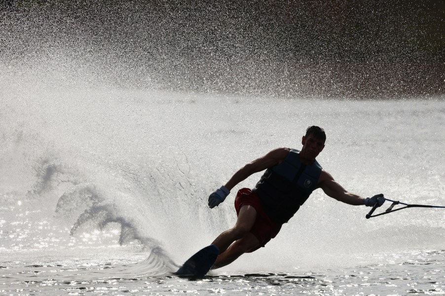 A person water skiing behind a boat in a waterway in Okeeheelee Park on March 26, 2021, in West Palm Beach, Florida