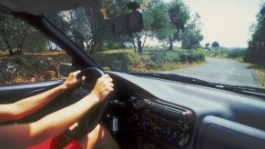 Woman driving an air-conditioned car, Island of Ibiza, Balearic islands, Spain