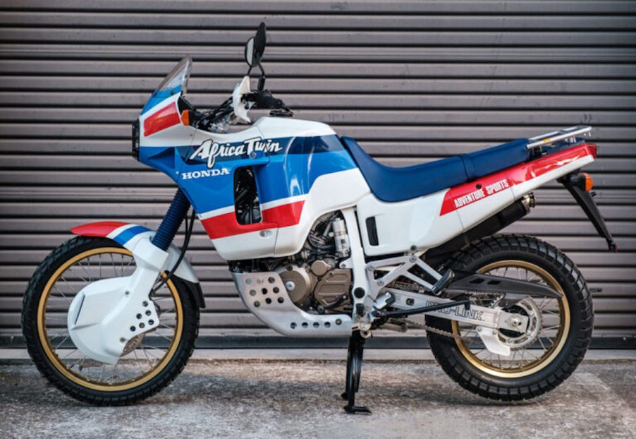 1989 vintage Honda Africa Twin parked in front of a garage