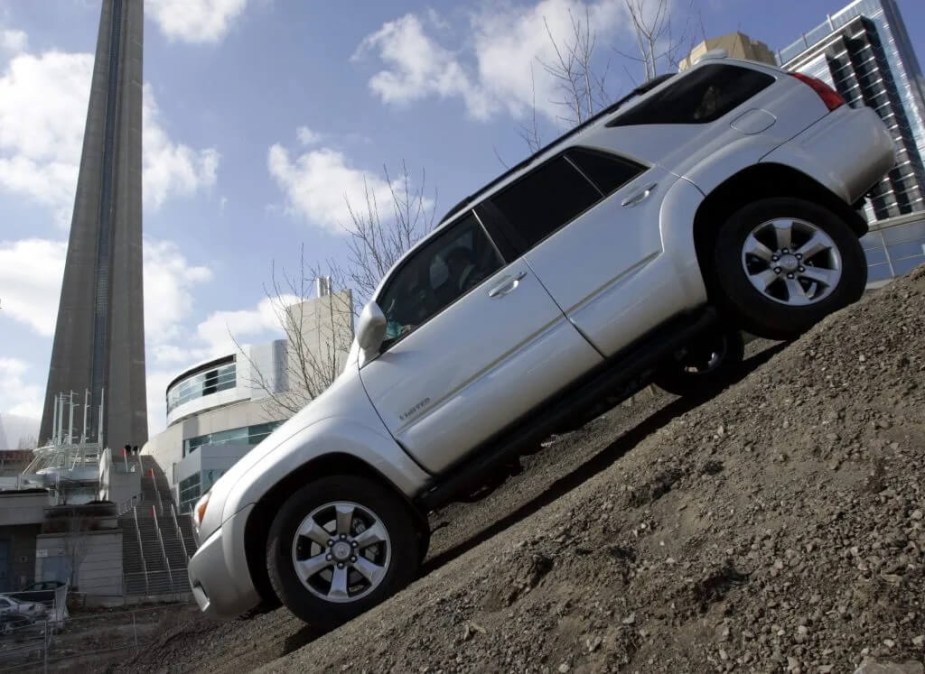 A 2006 silver Toyota 4Runner giving a off-road demo is one of the best used 4runner model years