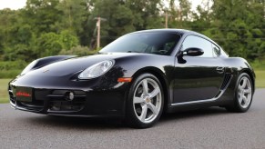 A black 2007 Porsche Cayman 5-Speed in a parking lot