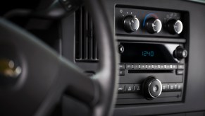 An image of a CD Player in a Chevrolet Express van, one of few models GM is killing the option for.