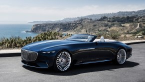 The dark-blue 2017 Vision Mercedes-Maybach 6 Cabriolet Concept on an ocean-side mountain road