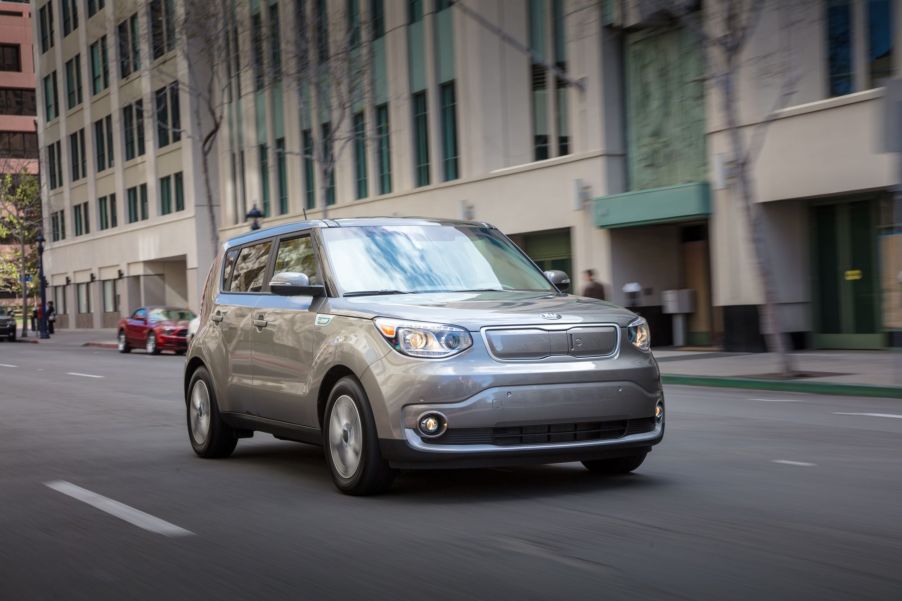 A gray 2019 Kia Soul EV model driving through a city