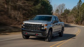 A silver 2020 Chevrolet Silverado Custom Trail Boss driving