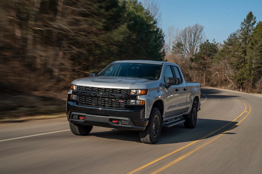 A silver 2020 Chevrolet Silverado Custom Trail Boss driving