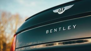 A close-up look at the logo on the trunk of a 2021 Bentley Flying Spur