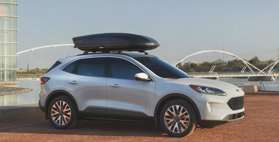 A white 2021 Ford Escape compact SUV parked overlooking a lake