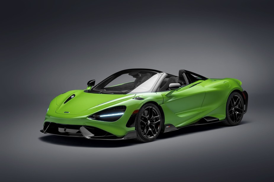 A green-and-black 2021 McLaren 765LT Spider with its roof down