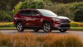 A red 2021 Toyota RAV4 Hybrid Limited SUV