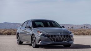 A grey 2022 Hyundai Elantra Hybrid in a desert area.