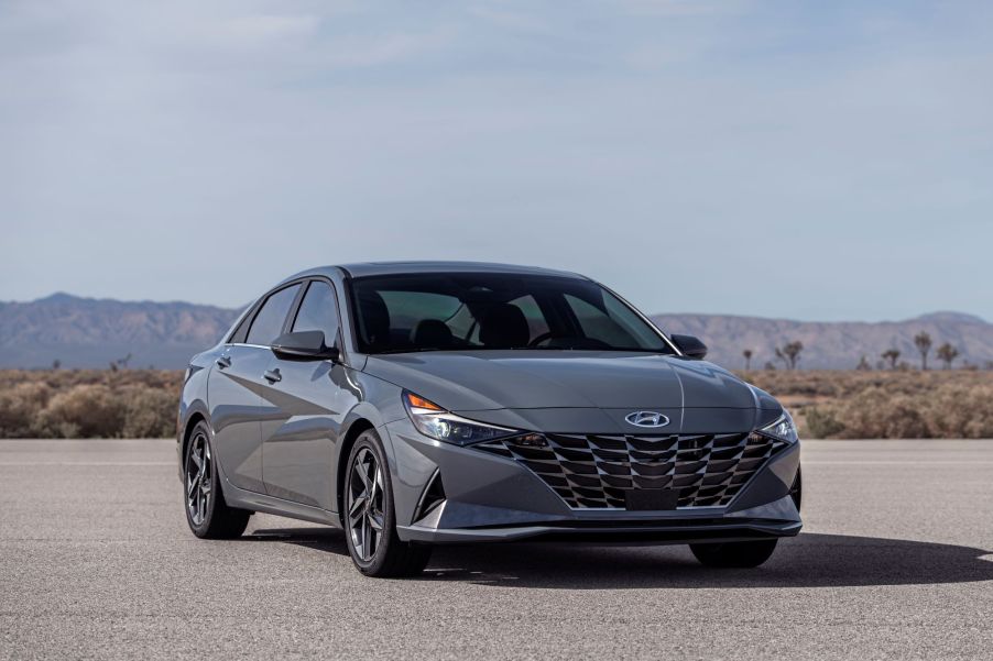 A grey 2022 Hyundai Elantra Hybrid in a desert area.