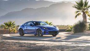 A blue 2022 Subaru BRZ on a desert racetrack