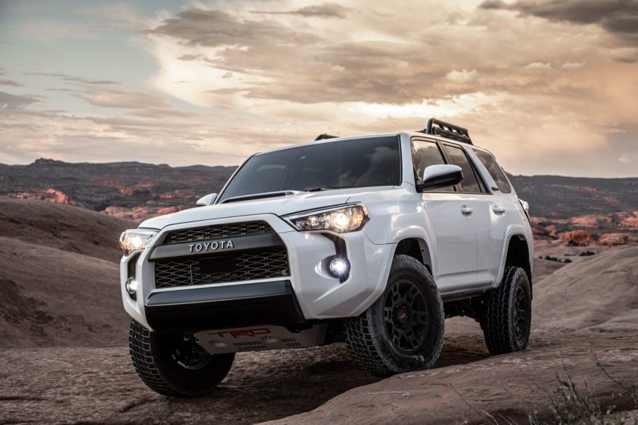 A white 2020 Toyota 4Runner TRD pro climbing rocks on mountain trails