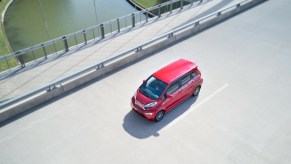 A bright red Kandi K23 on the open road