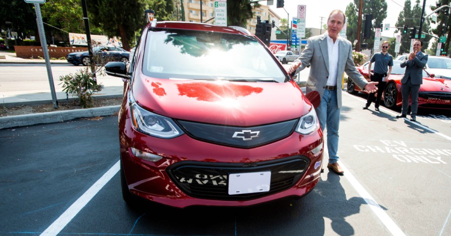 Congressman Adam Schiff plugs in his Chevy Bolt during the unveiling of new electric vehicle charging ports in Downtown Burbank on Monday, July 12, 2021.