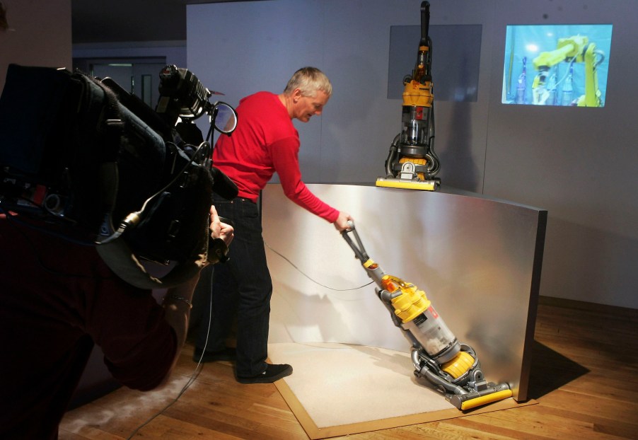 Inventor James Dyson demonstrates his latest vacuum cleaner on March 14, 2005, in London