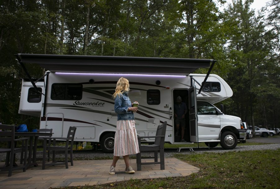 A travel writer enjoying her rented RV at a scenic camp ground