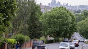 Cars sit on a road in traffic in London, England