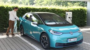 A battery electric vehicle being charged at a station