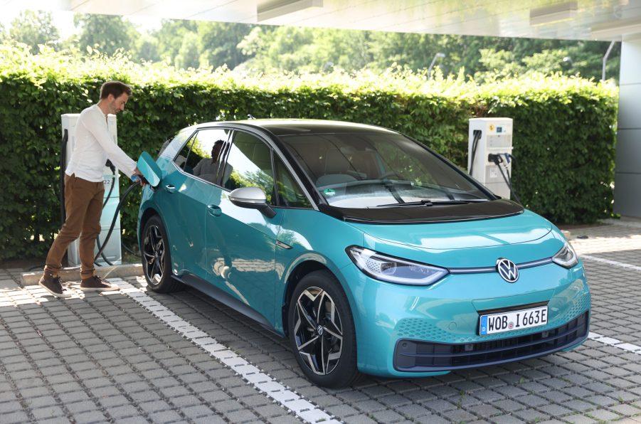 A battery electric vehicle being charged at a station