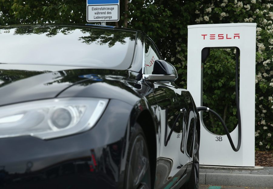 A black Tesla Model S charging