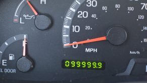 A car's odometer, on the cusp of going over 100,000 miles