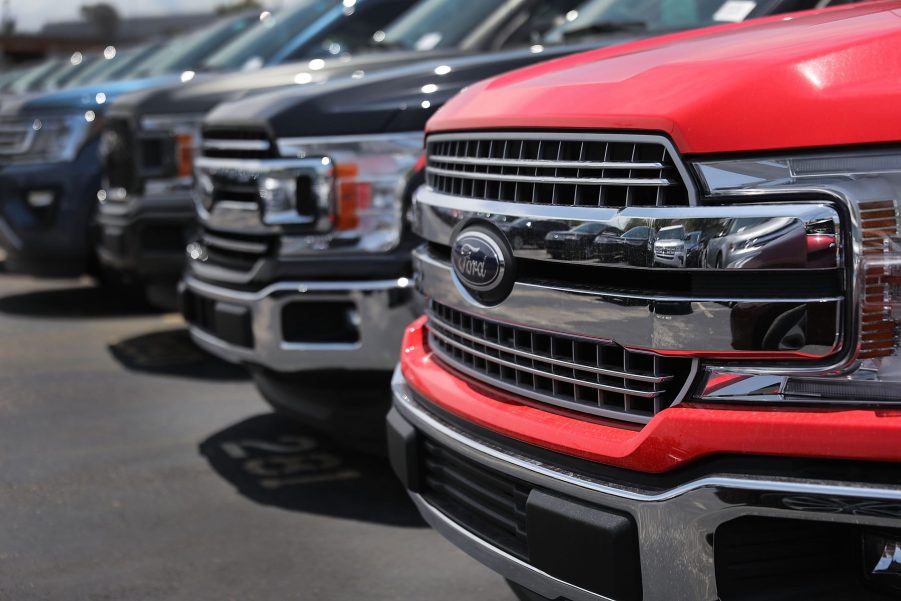 A line of Ford F-150 trucks in a parking lot, among the models not affected by the recent Ford recall