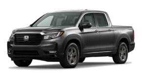 A gray Honda Ridgeline against a white background.