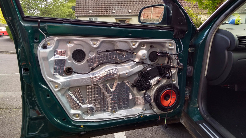 A car where sound deadening material was added to the door panel.