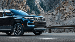 The Jeep Grand Wagoneer SUV model parked on a mountain highway