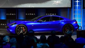 A bright-blue metallic Karma Revero GTS sports sedan at the Automobility LA Technology Pavilion in November 2019