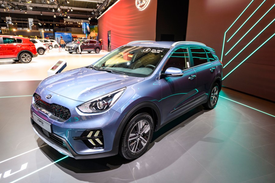 A Kia Niro Hybrid SUV at an auto show,