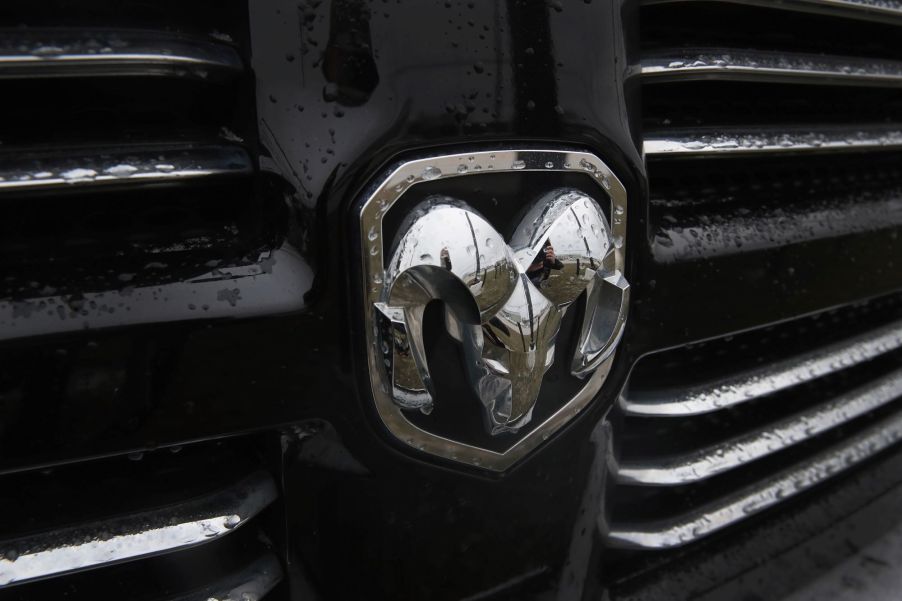 A Ram logo embedded on the grille of a pickup truck