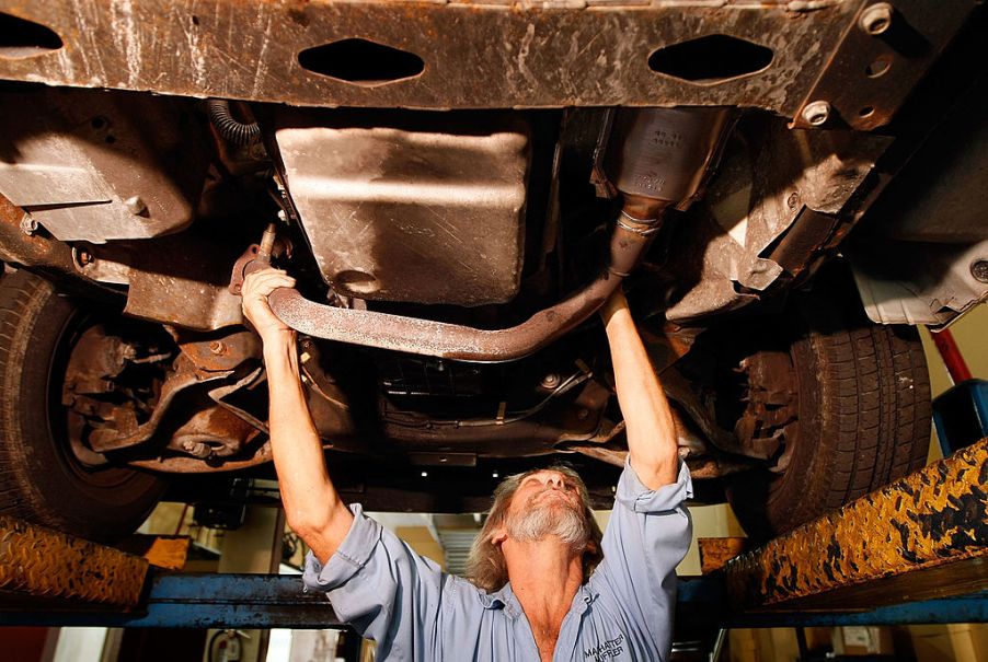 technician removing a catalytic converter