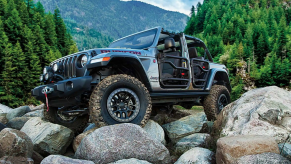 The 2021 Jeep Wrangler 4xe crawling over rocks