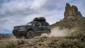 A black 2021 Ford Bronco Sport kicking up dirt