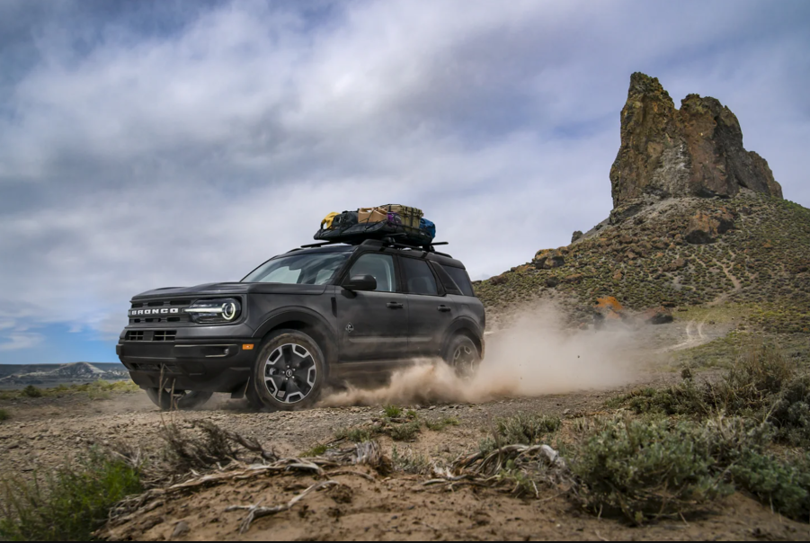 A black 2021 Ford Bronco Sport kicking up dirt