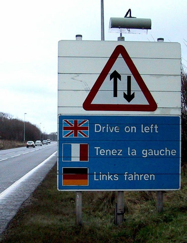 sign telling European drivers to drive on the left side of the road in the U.K. in case they have left-hand drive American cars