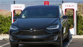 A Tesla electric vehicle supercharging station near the Tejon Ranch Outlet Stores in the Tehachapi Mountains, adjacent to Interstate 5, is viewed on July 7, 2021, near Lebec, California.