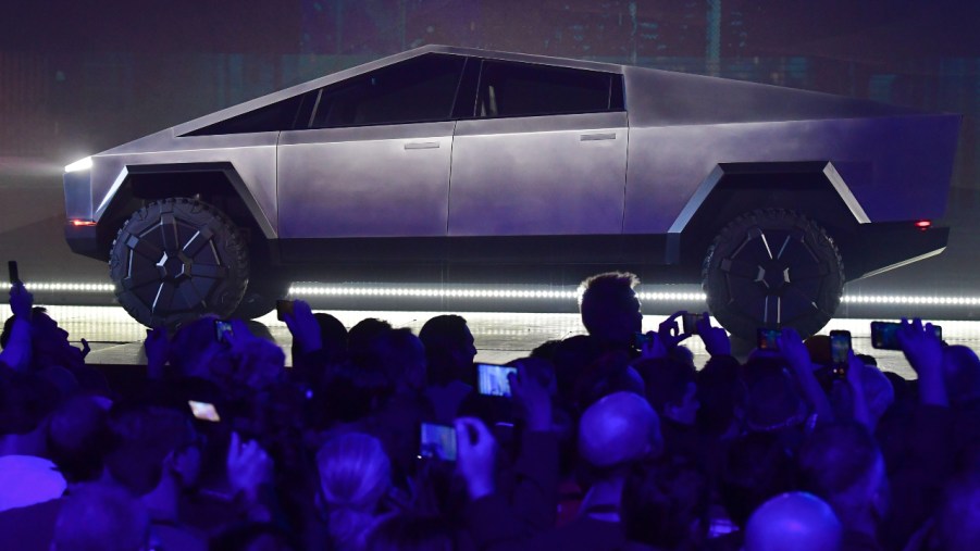 People take pictures of the newly unveiled all-electric battery-powered Tesla's Cybertruck at Tesla Design Center in Hawthorne, California on November 21, 2019.