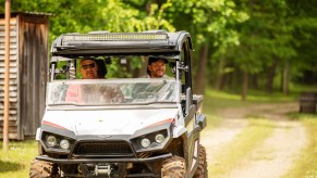 Two men riding in a UTV