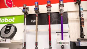 A row of vacuum cleaners in a store