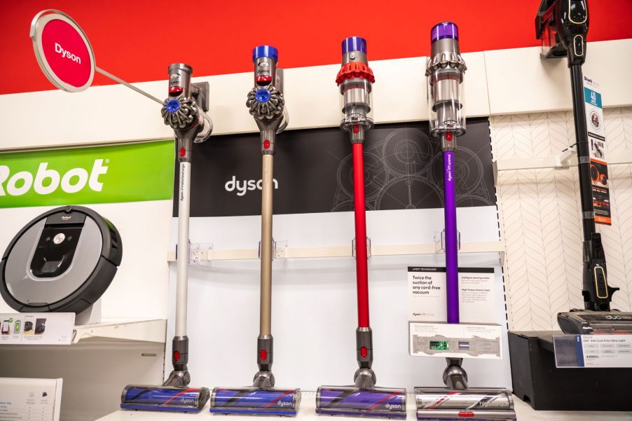 A row of vacuum cleaners in a store