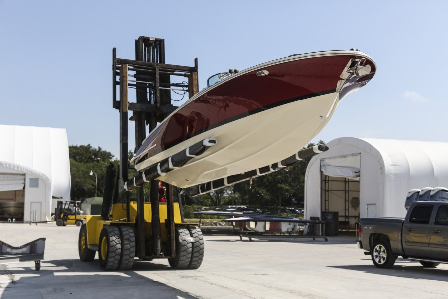 A forklift holds a Launch 27 boat at Winnebago Industries' Chris-Craft manufacturing facility in Sarasota, Florida, in June 2018